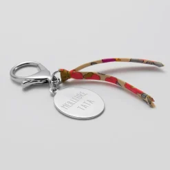 Bijou de sac personnalisé médaille gravée acier ovale 33x25 mm et noeud Liberty
