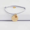 Bracelet enfant personnalisé médaille gravée plaqué or 15 mm et breloque fleur zircon plaqué or 8 mm