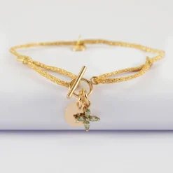 Bracelet fermoir personnalisé cordon pailleté médaille gravée plaqué or 10 mm et breloque fleur pétales zircons 10 mm