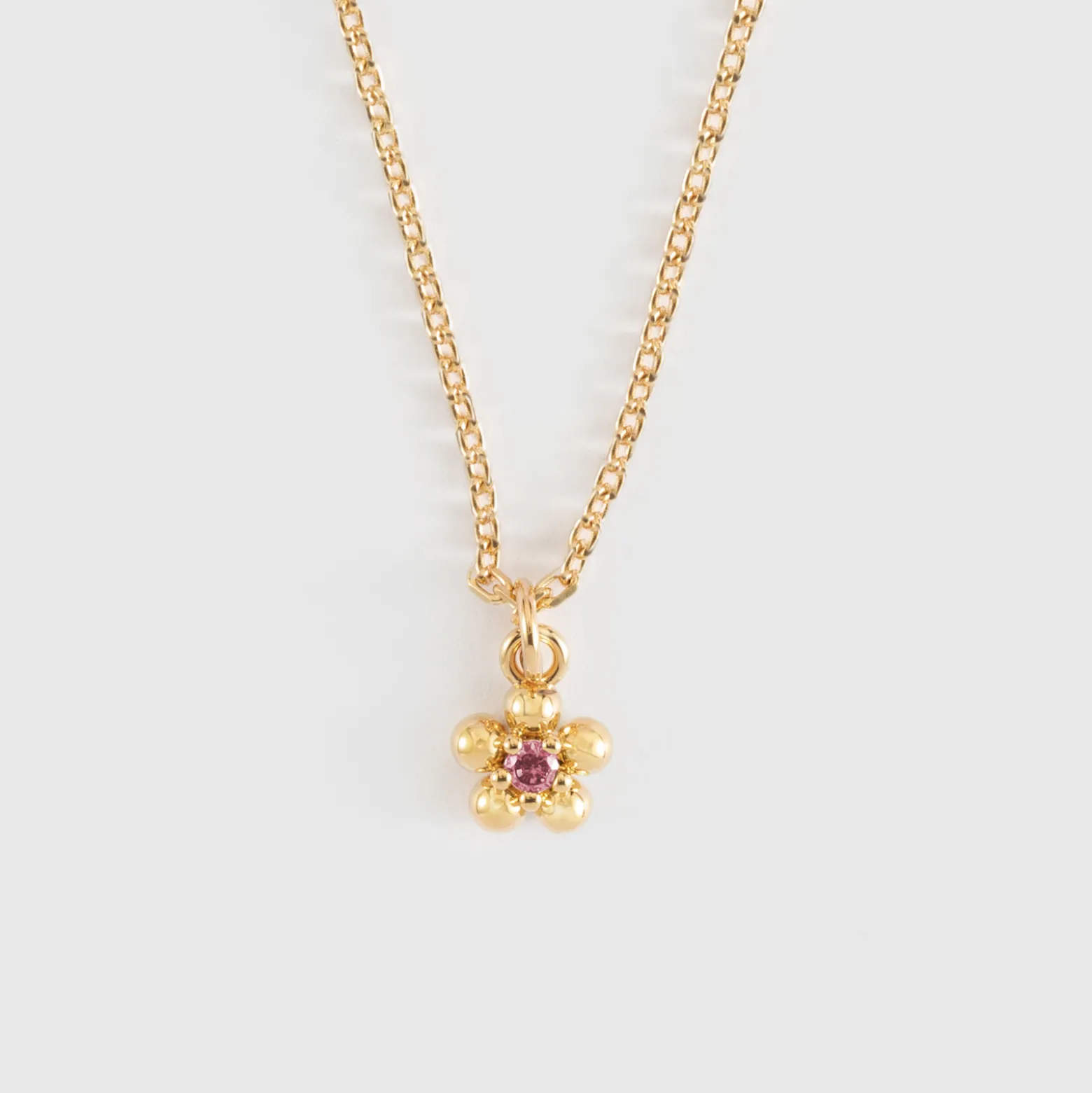 Pendentif enfant fleur zircon plaqué or 8 mm