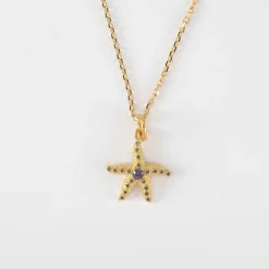 Pendentif enfant étoile de mer scintillante zircons bleus plaqué or 15 mm