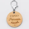 Porte-clés gravé bois médaille ronde 50 mm - Edition spéciale "Super Parrain"
