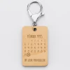 Porte-clés personnalisé calendrier médaille gravée bois